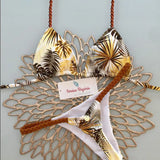 Estampa tropical de folhas em tons de marrom